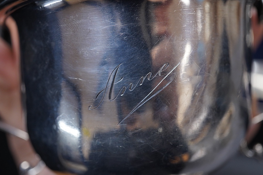 A George V Britannia standard silver mug, by Thomas Bradbury & Sons, Sheffield 1918, height 65mm, handle a.f., together with a 1930's silver porringer and a George V cased silver christening bowl and spoon, 13.2OZ.